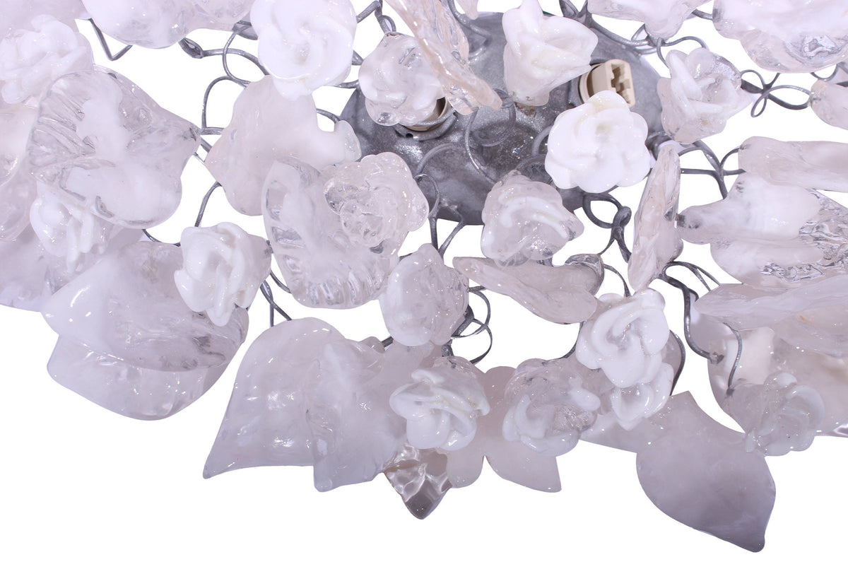 Silver Sconce With Whimsical Resin Leaves In clear and white color.
