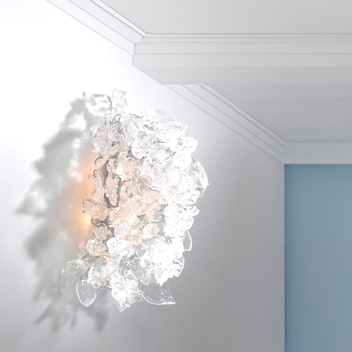 Bronze Sconce With Whimsical Resin Leaves In clear color.